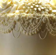 beige lacey wedding cake