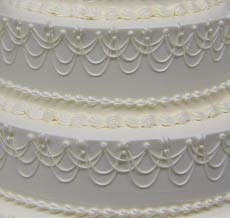 drop string white wedding cake