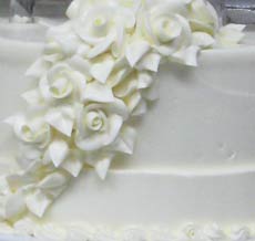 ribbons and cascading flowers wedding cake